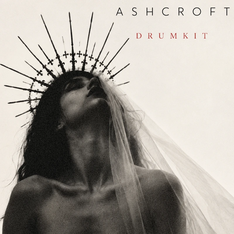 ASHCROFT drum kit cover: monochrome portrait with an ornate spiked crown and crimson lettering.